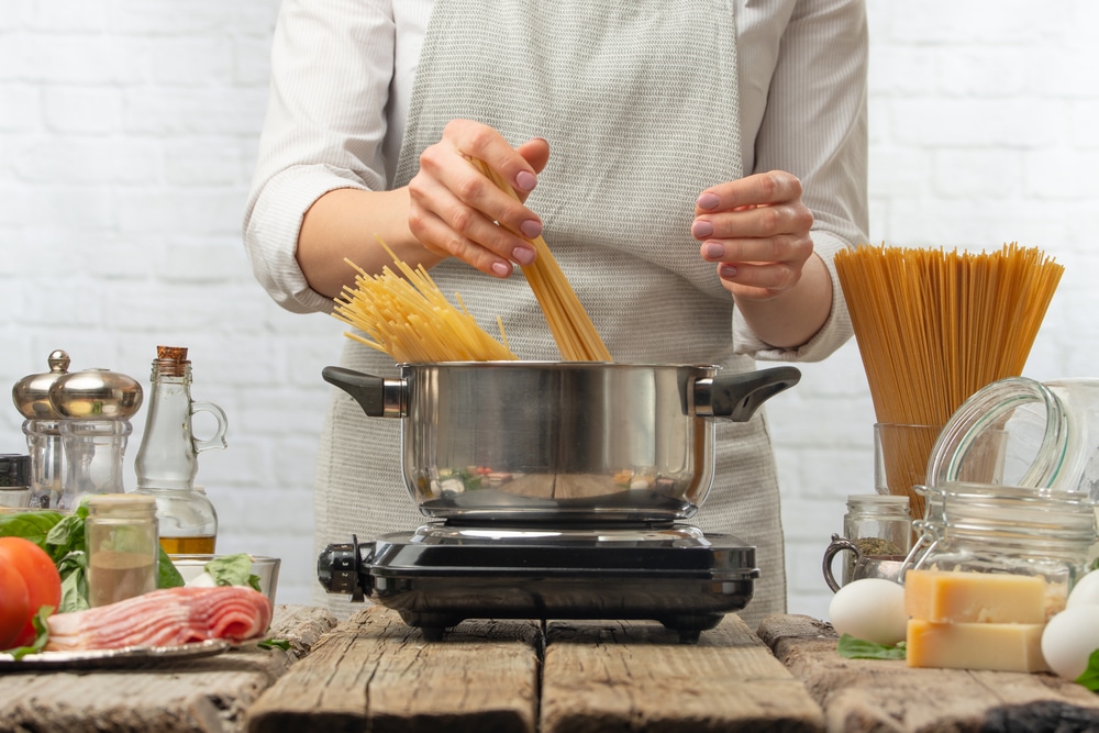 professional chef making spaghetti