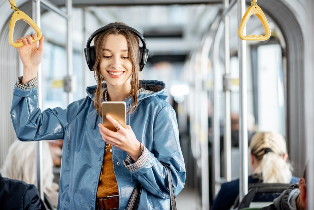 girl studying language flashcards on train