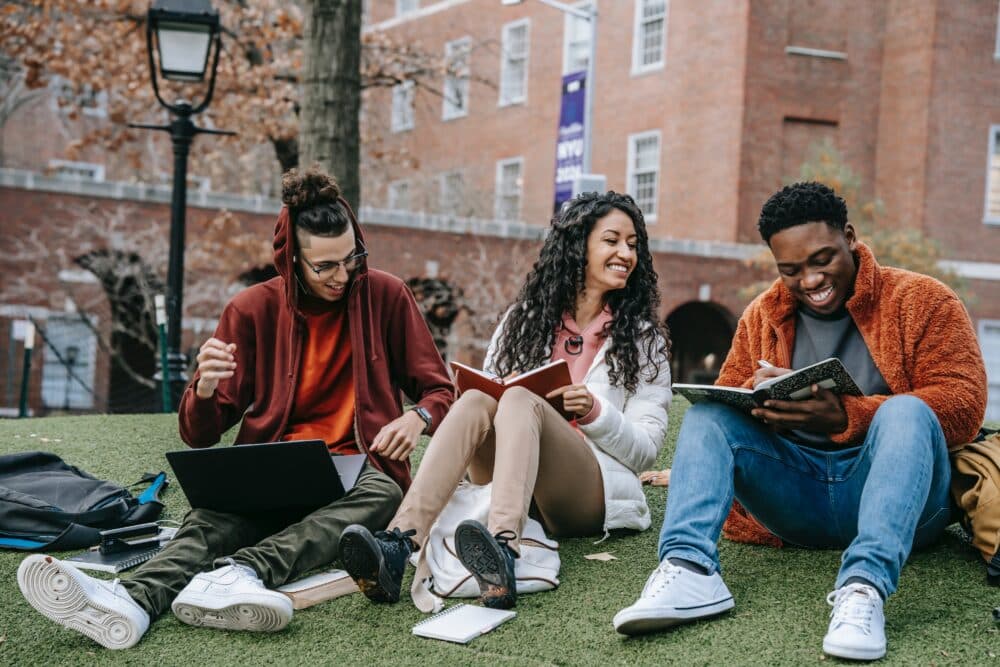 happy-students-studying-together-outside