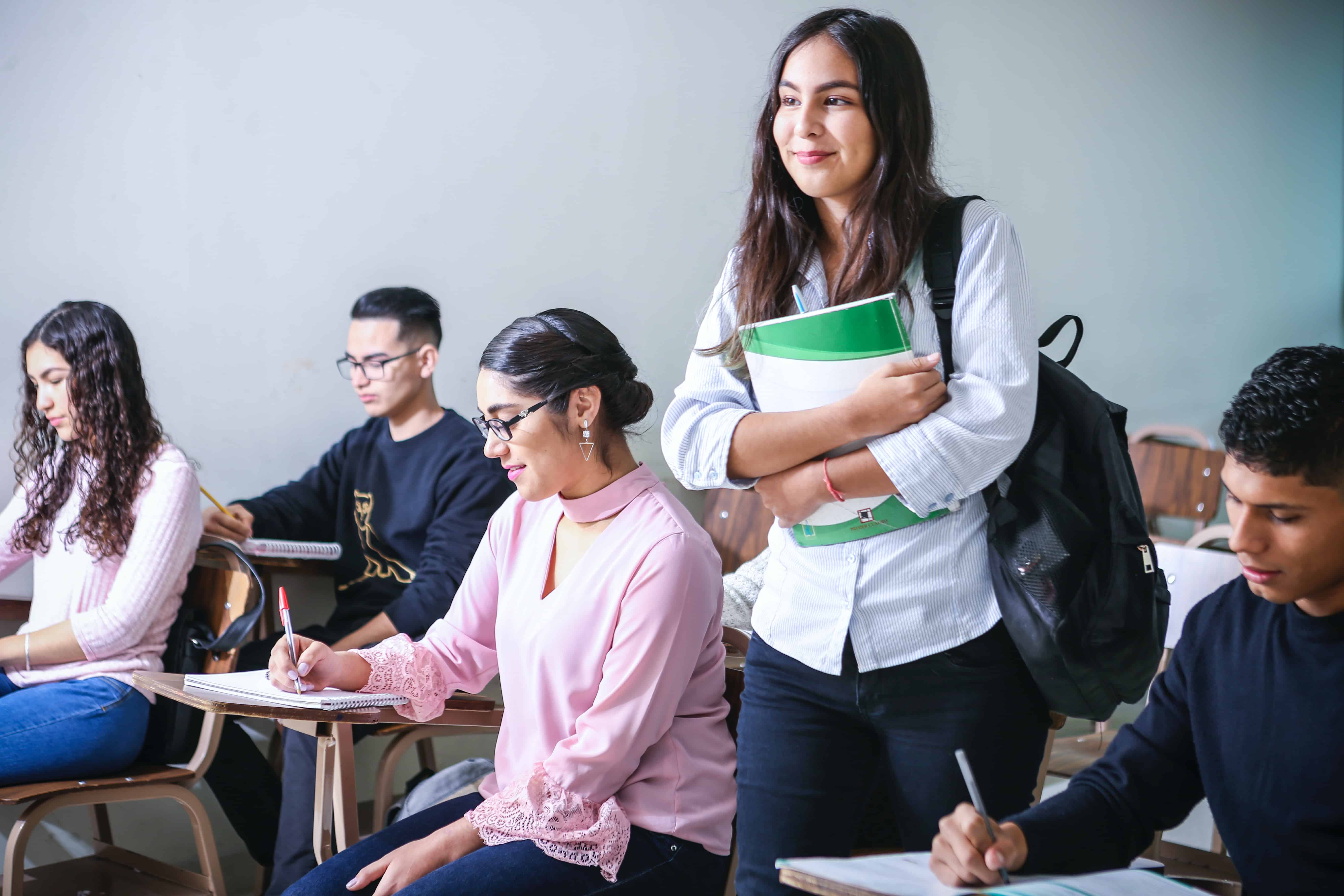 A student stands up in class to speak