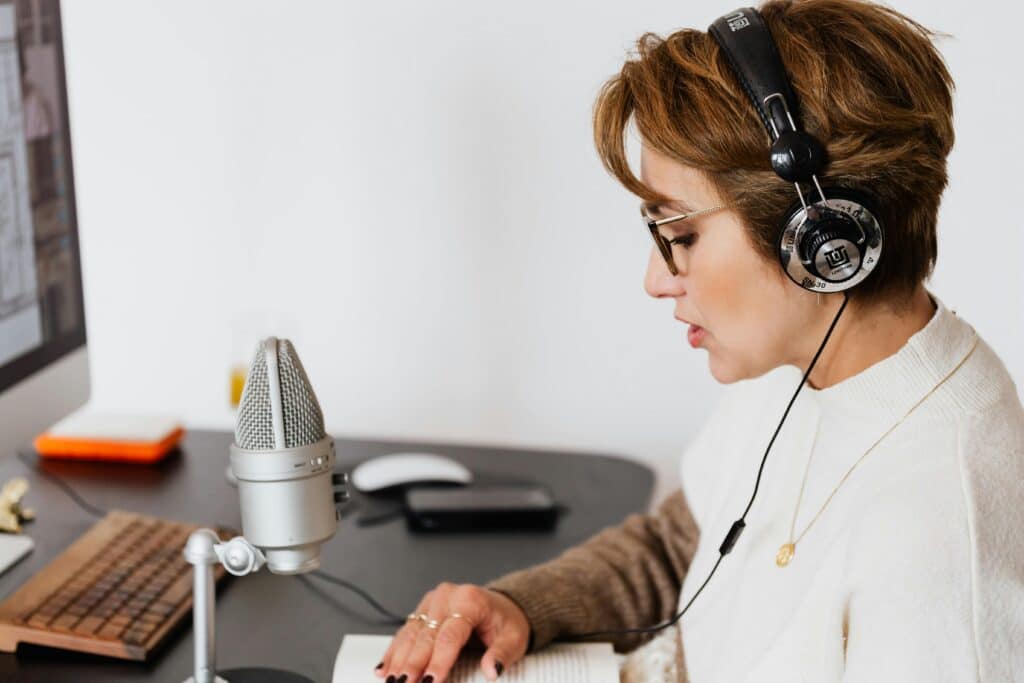 woman-speaking-with-headphones-on