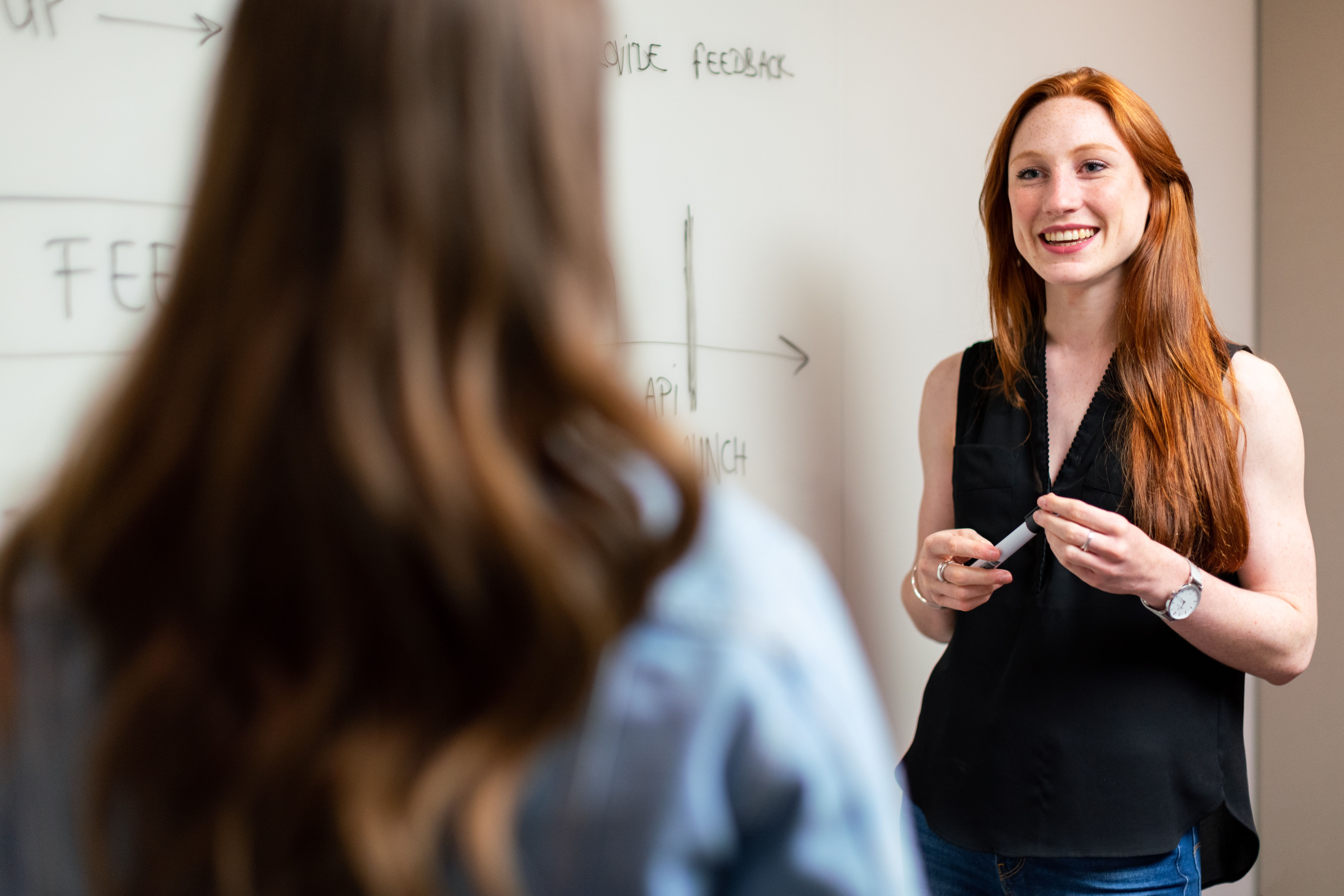 A teacher speaks to a student