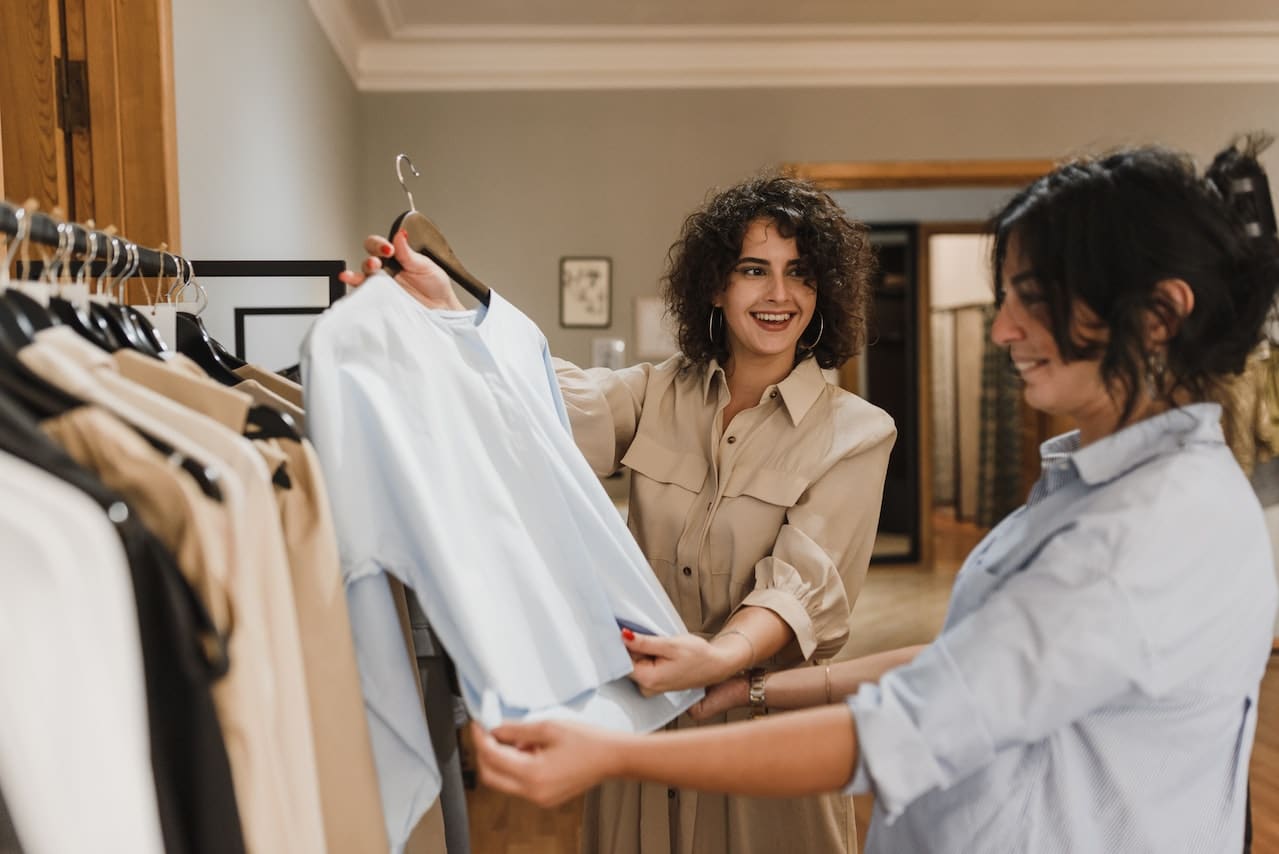 Two women interacting in a store