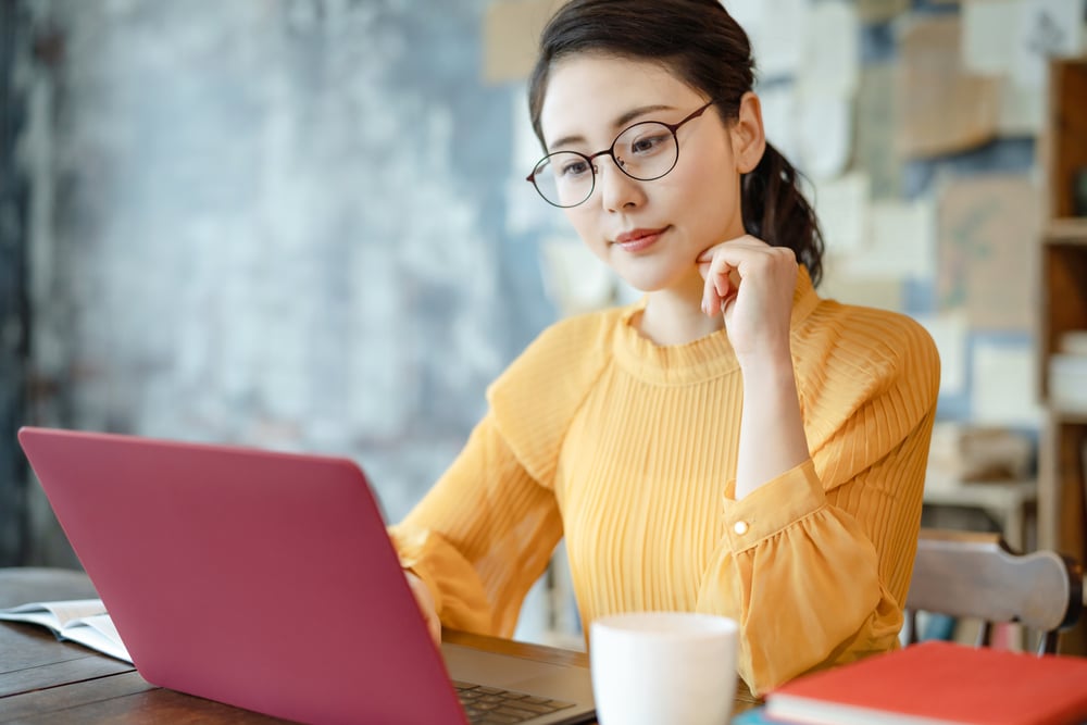 woman learning a language on her laptop